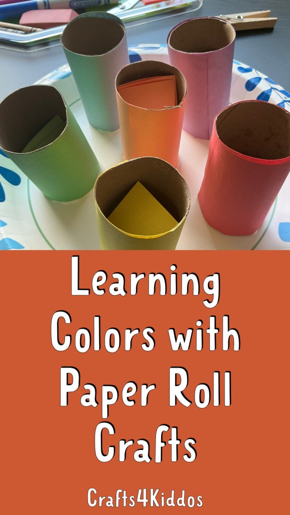 Colorful paper rolls arranged on a plate, with some paper squares visible inside the rolls, illustrating a craft activity for learning colors.