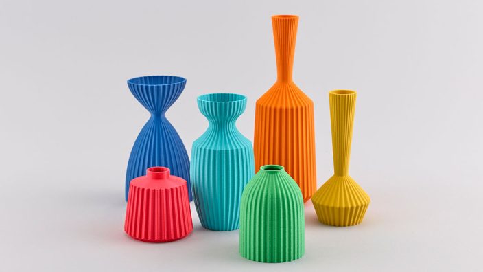 KeeleyTraae_ColourTextureForm_PhotoDavidPRowan Six brightly coloured, differently sized vases. Each vase is entirely one colour, and differently shaped. The surfaces are decorated with many sharp grooves, creating lines top to bottom.