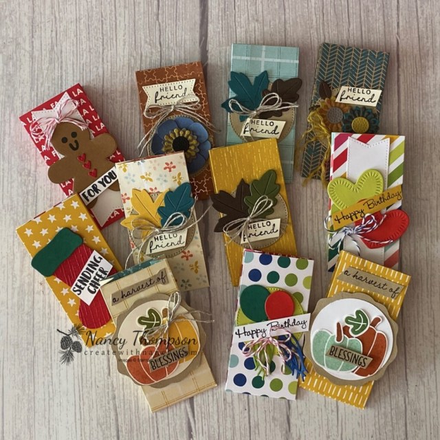 This is a photo of varies Treat Holders in all kinds of themes. Fall, Christmas, and Birthday. The treat holders are made out of designer paper and die cut or punched shapes with added embellishments of ribbon.