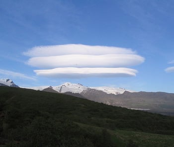 Mundane objects like these lenticular clouds above Skaftafell glacier in Iceland are mistaken as flying saucers due to our cultural conditioning to believe in such things.