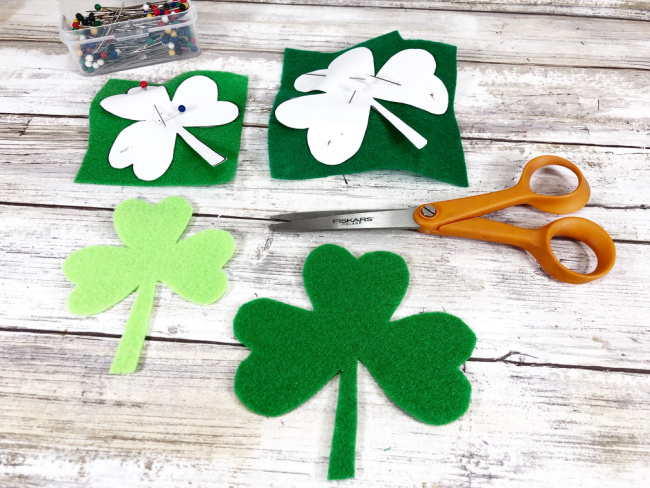 pinned shamrock patterns on felt to cut out felt shapes