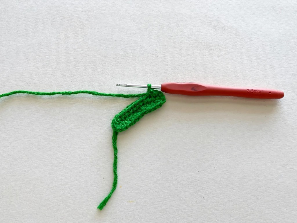 Leaf beginning to take shape with decreases worked along the edge.