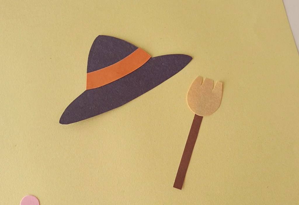 Paper witch hat and broom assembled for the moving ghost puppet