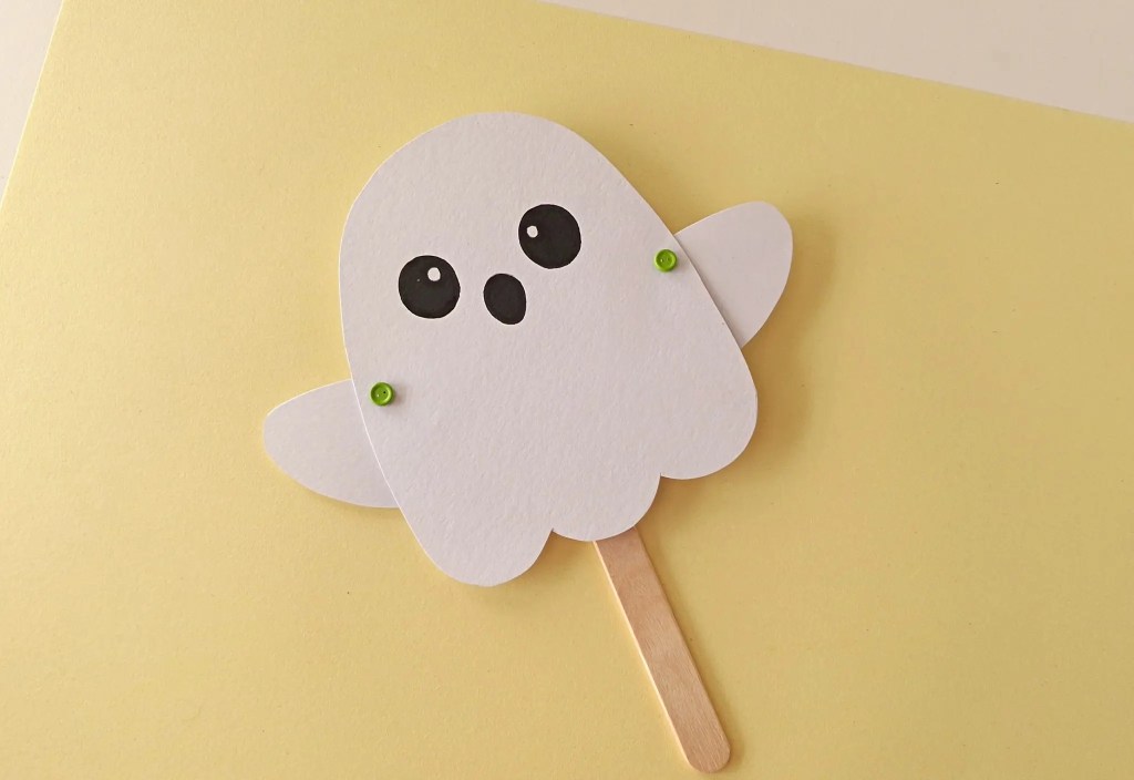 Front of the ghost puppet showing visible green brad fasteners