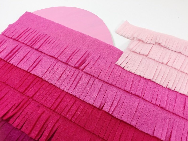 Add ombre fringe from darkest to lightest Creatively Beth #creativelybeth #ombre #fringe #heartcrafts #valentinesdaycrafts