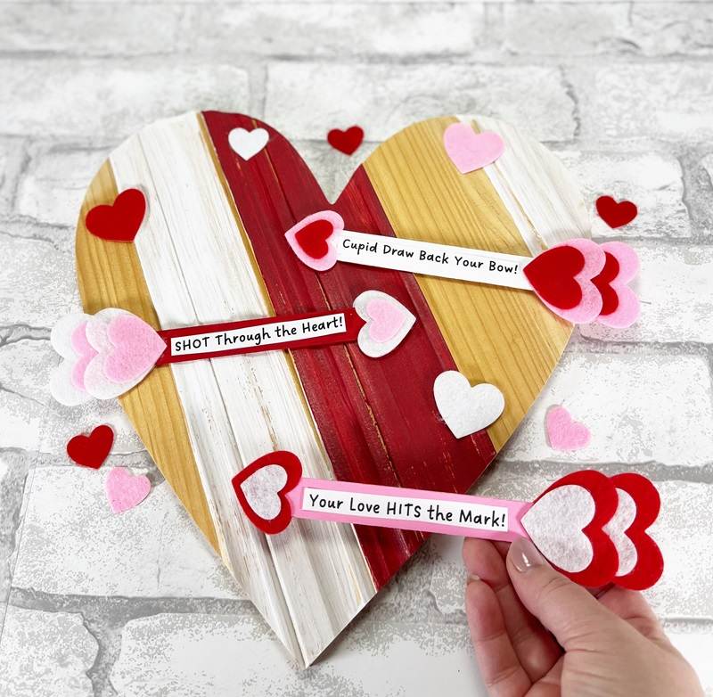 Dollar Tree Craft Stick Arrow for Valentine's Day with Free Printable Sayings Creatively Beth #creativelybeth #dollartree #craftstick #popsiclestick #valentine #valentinesday #freeprintable #arrow #kids #craft #diy