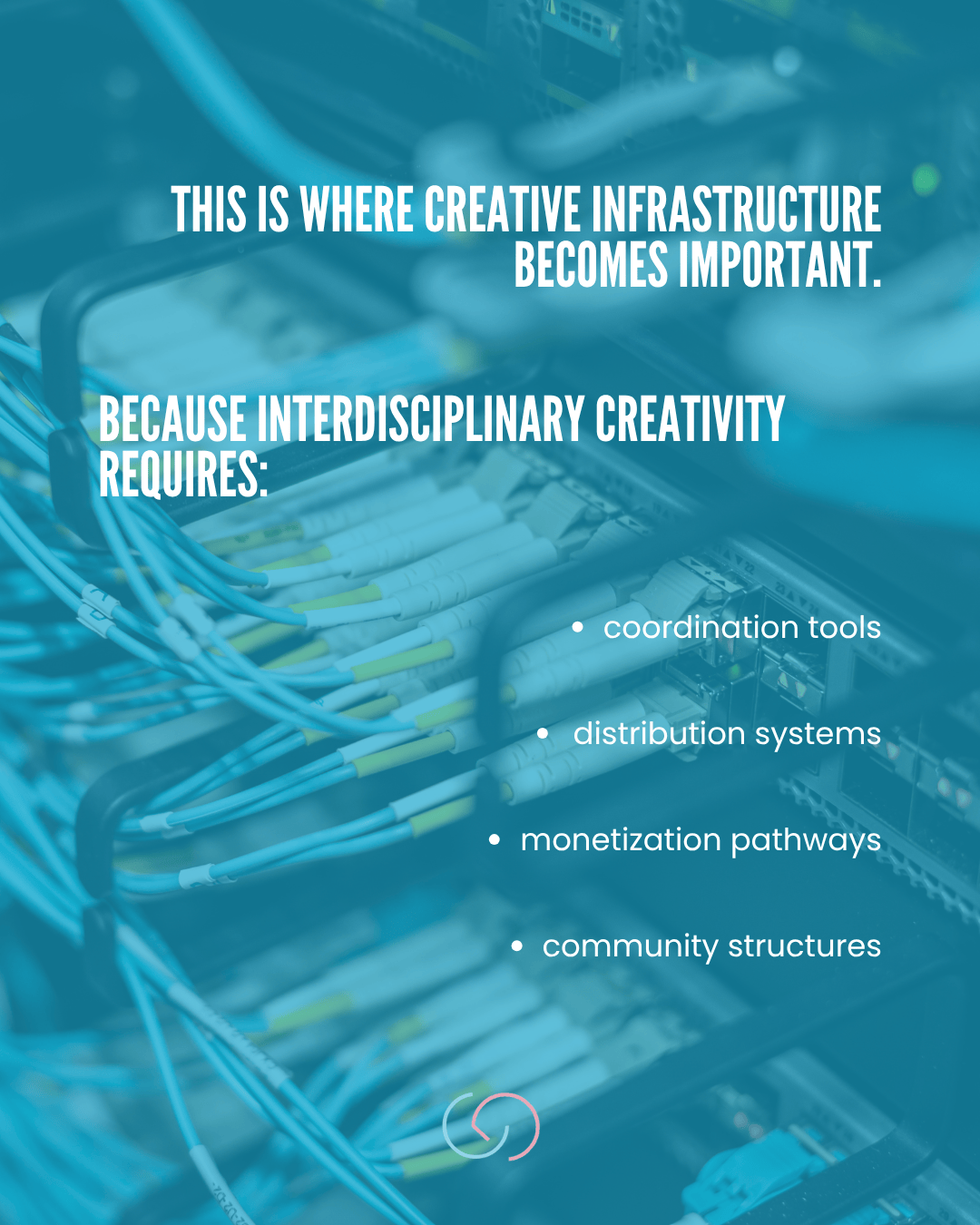 A close-up view of a server rack with various cables and connections, illustrating creative infrastructure's importance for interdisciplinary creativity.