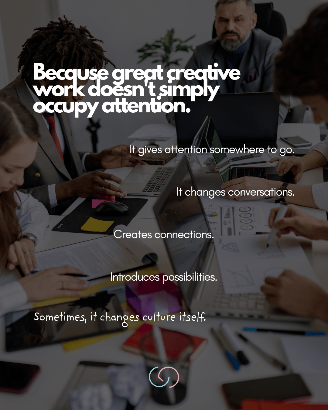 A group of professionals engaged in a collaborative meeting, with laptops and documents on the table, emphasizing the importance of creative work in fostering conversation and connection.