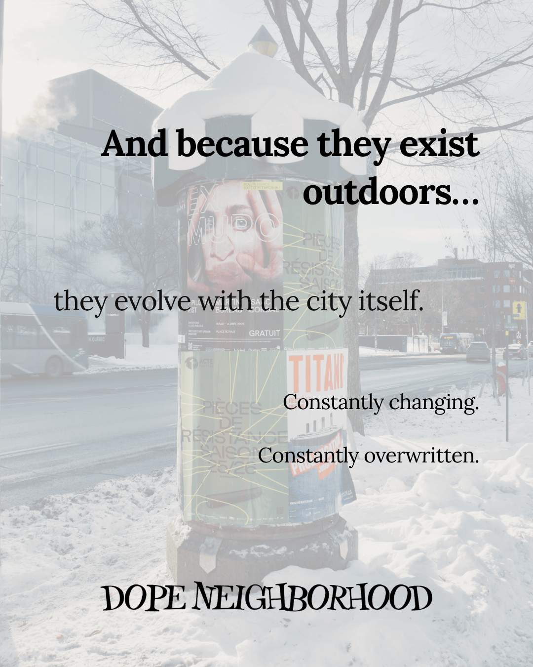 A snow-covered street scene featuring a poster kiosk displaying various advertisements and a message about urban evolution.