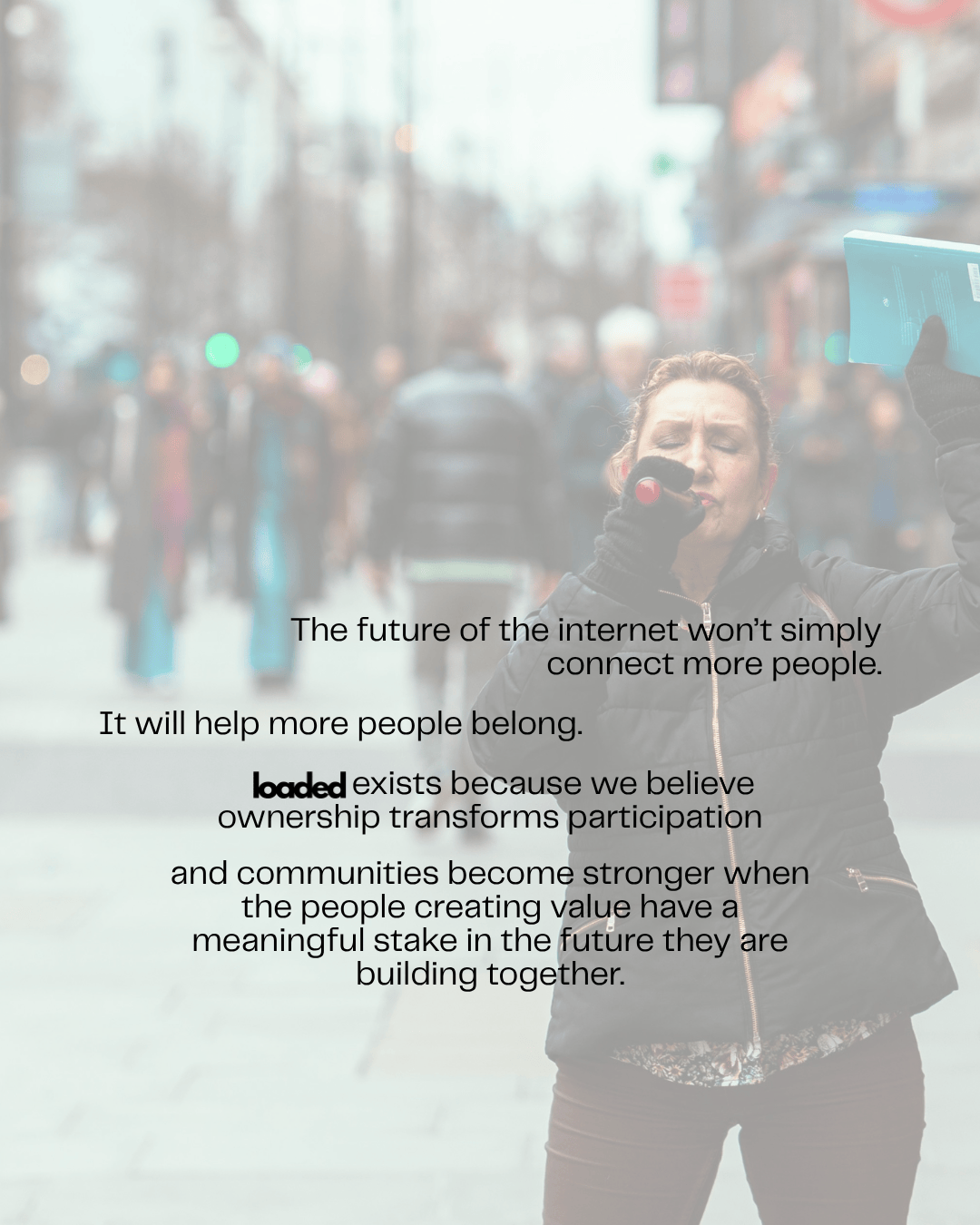 A woman speaking into a microphone while holding a blue book, with a blurred crowd walking in the background. Text overlays discuss the future of the internet and community ownership.