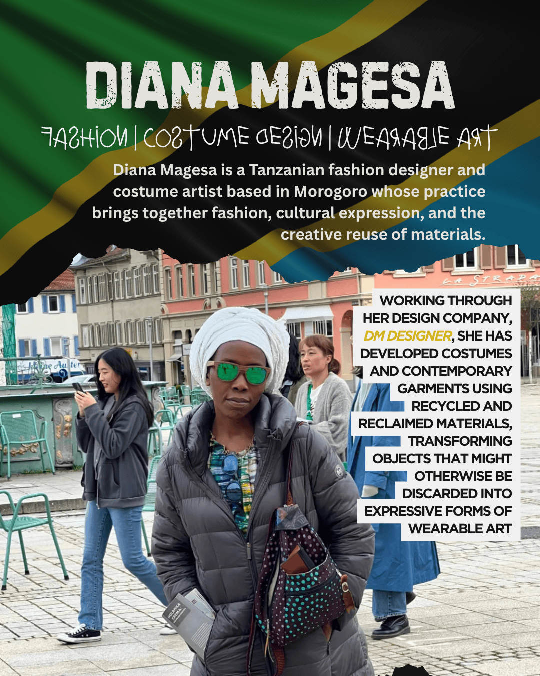 Image of Diana Magesa, a Tanzanian fashion designer, standing in an urban setting wearing sunglasses and a patterned coat, holding design materials. In the background, other people are seen walking and engaging with their phones.