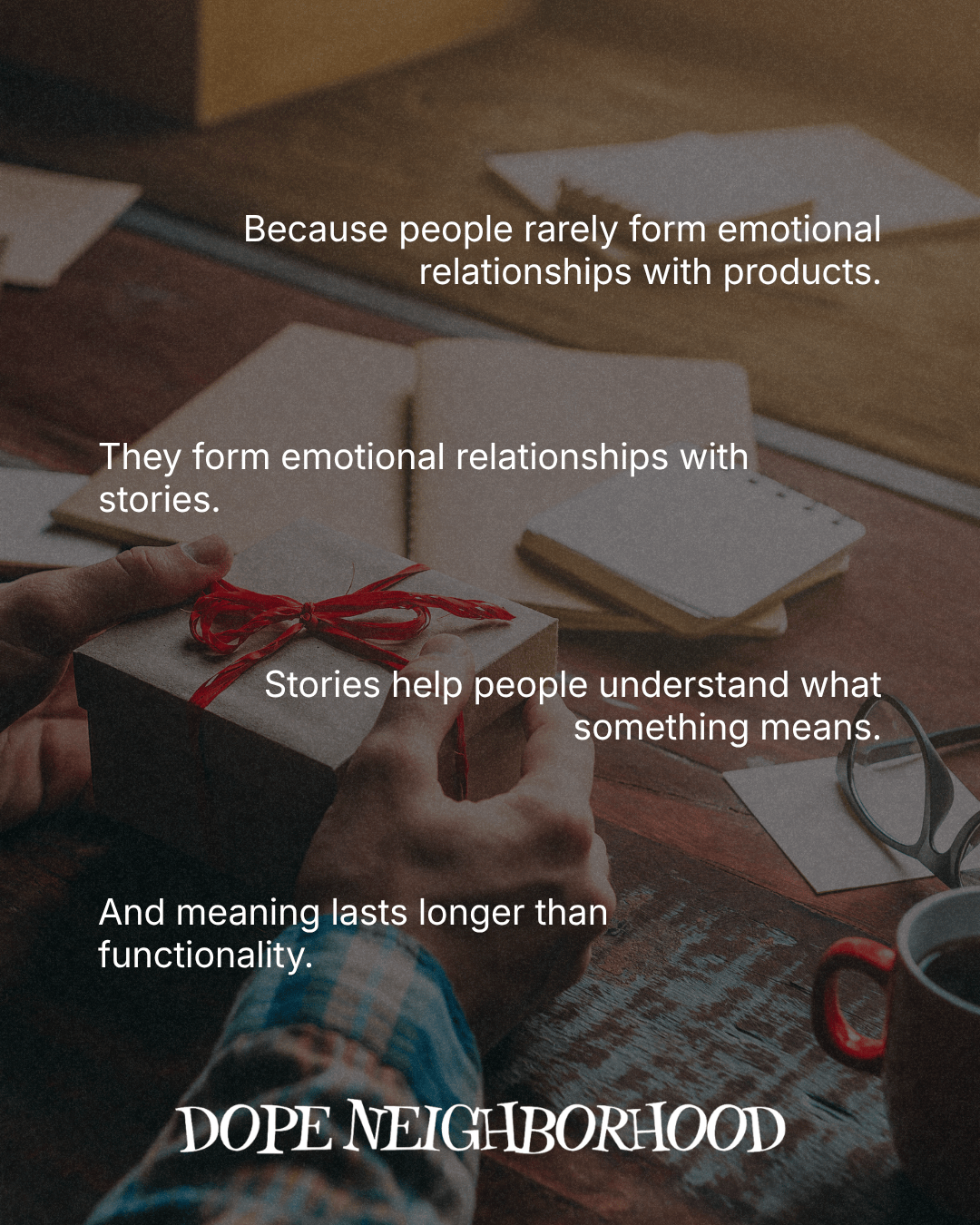 A person's hands holding a gift with a red ribbon on a wooden table, with notes and a cup beside it. Text overlay discusses emotional relationships with products and the importance of stories.