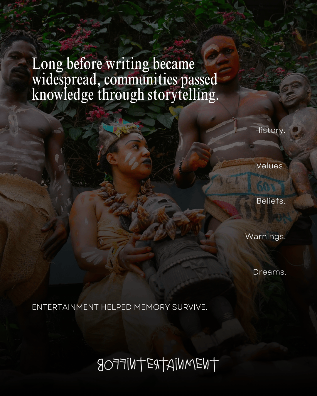A group of individuals dressed in traditional attire, showcasing cultural storytelling through dance and performance. Decorations and props, including a carved figure, emphasize the importance of oral history and community values.