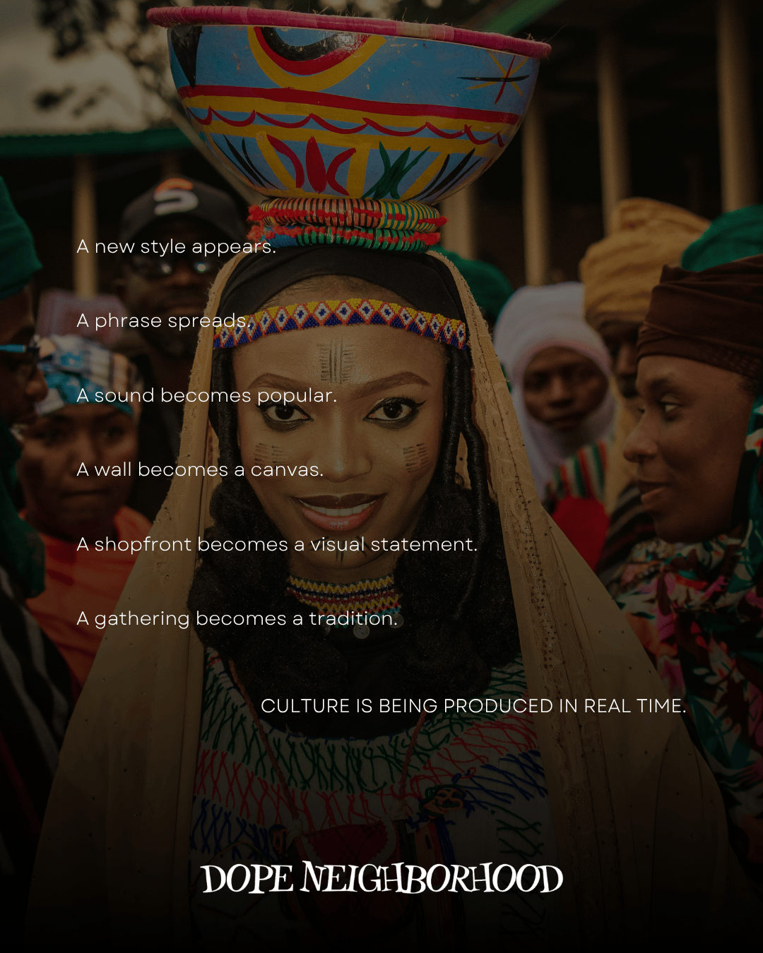 A woman adorned in colorful traditional attire with a decorative bowl on her head, surrounded by people in a vibrant cultural setting.