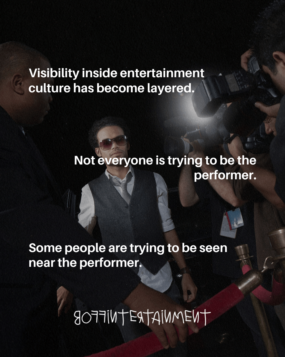A man wearing sunglasses and a vest interacts with a crowd of cameras and people in a nightlife setting, emphasizing the complexities of visibility in entertainment culture.