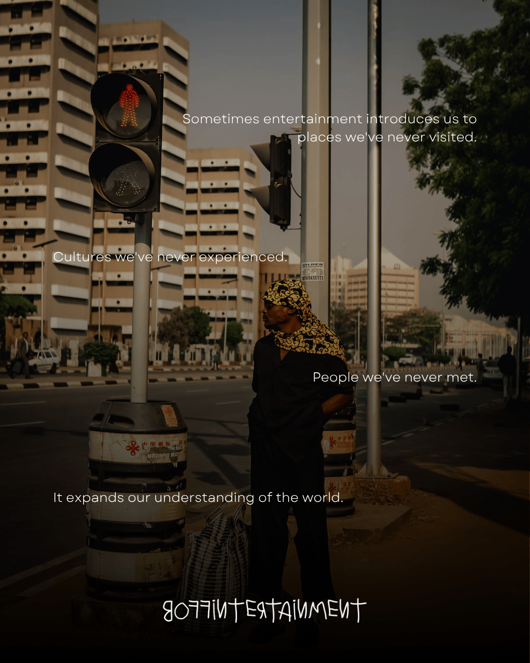 A person standing at a street crossing near traffic lights, with urban buildings in the background. The image features text overlay discussing the impact of entertainment on cultural understanding.