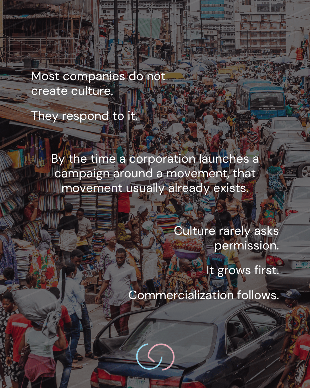 A busy marketplace scene with people walking through crowded streets, surrounded by stalls selling colorful fabrics and goods. Text overlaid on the image discusses the relationship between companies, culture, and commercialization.