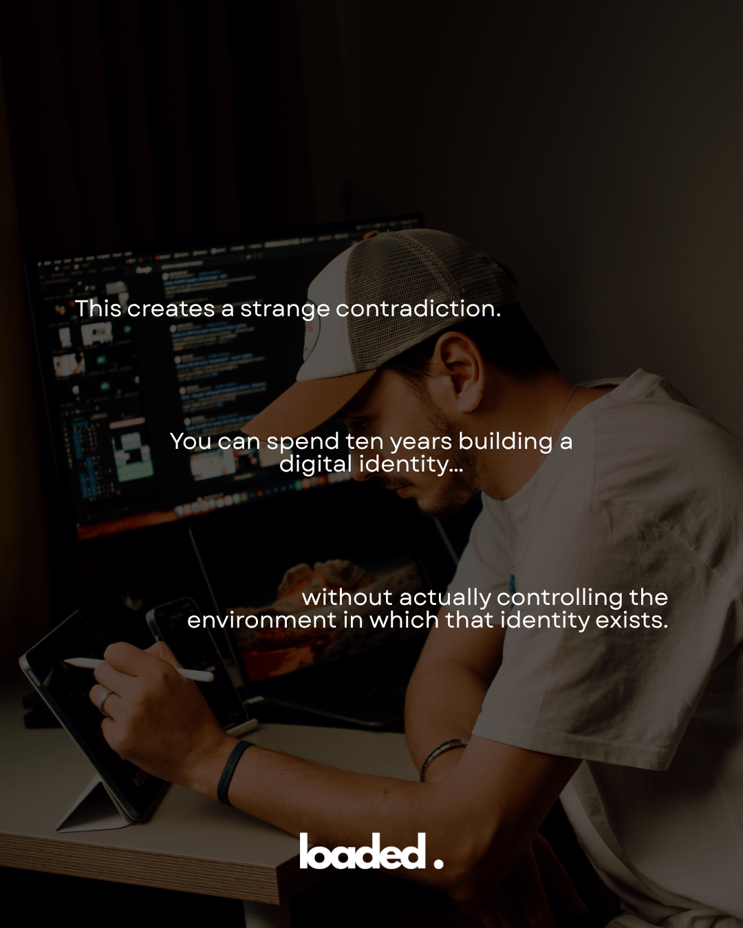 A person sitting at a desk, focused on a digital tablet, with a computer monitor displaying various digital content in the background. Text overlays discuss the complexities of building a digital identity.