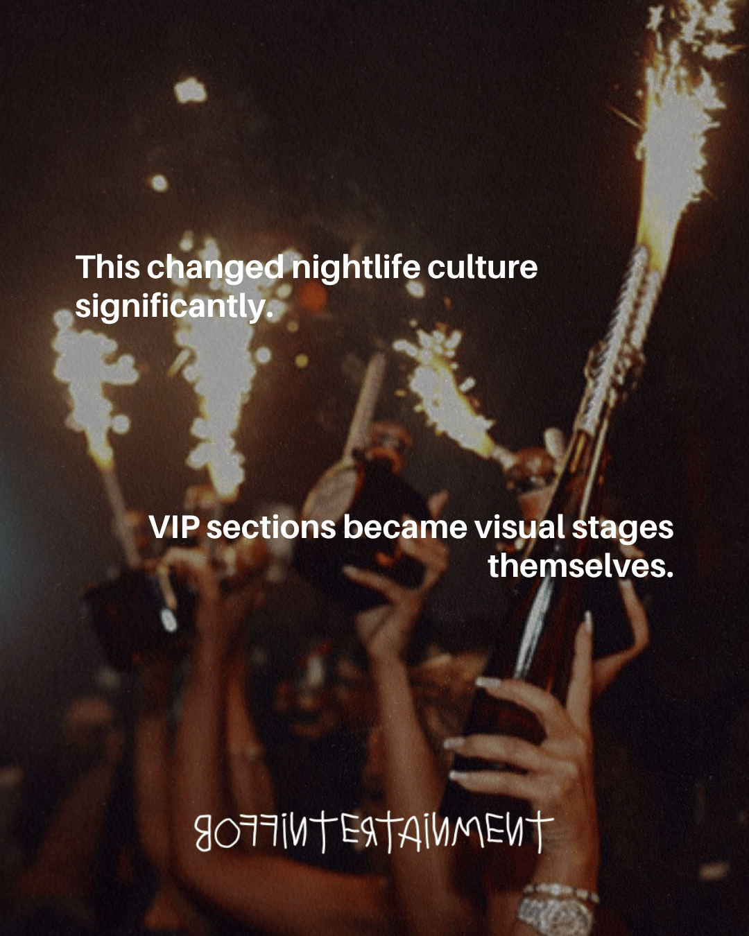 A dimly lit nightclub scene featuring multiple hands holding champagne bottles and sparklers, highlighting the vibrant nightlife culture.