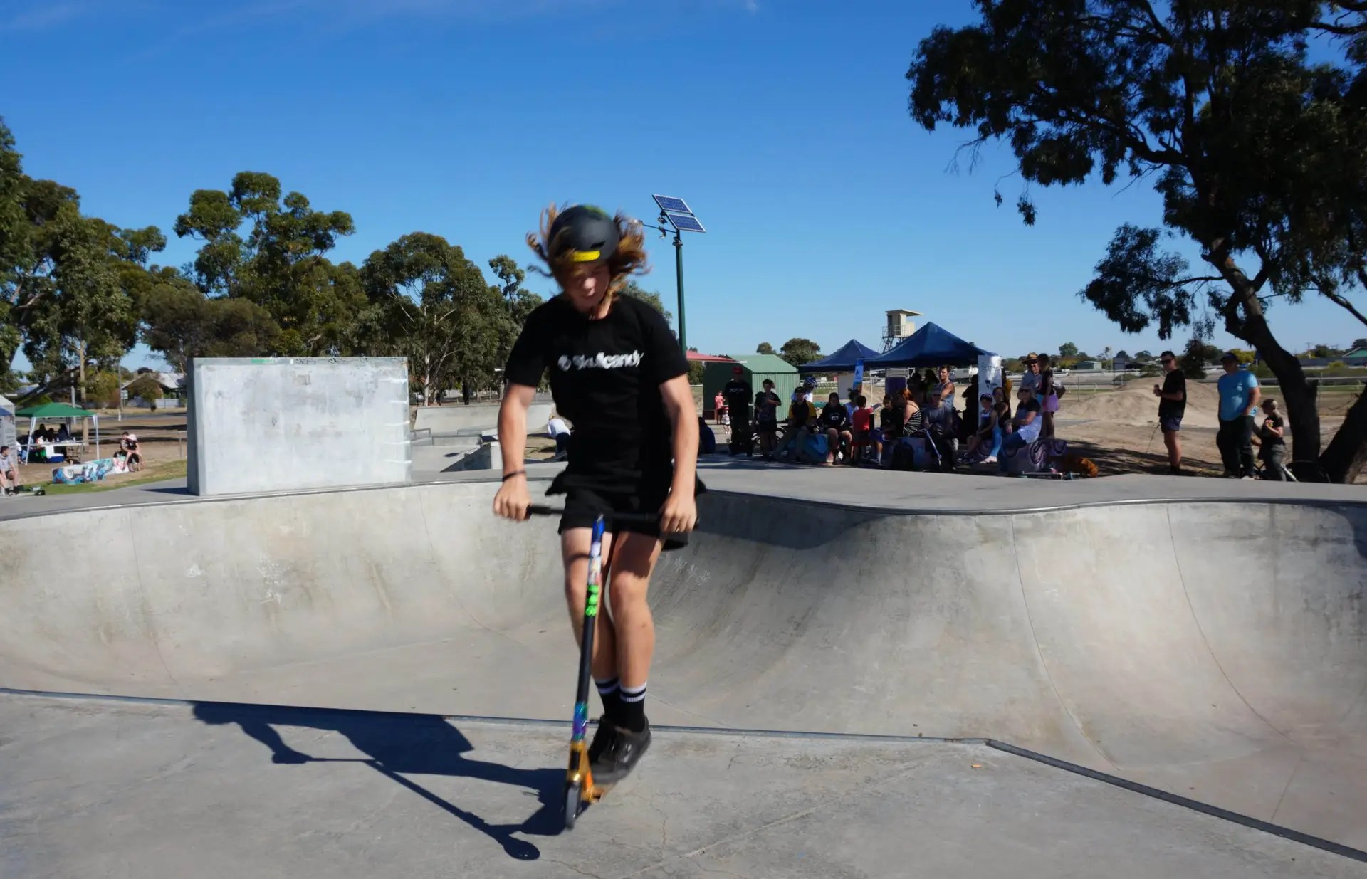 CRED Consulting, Young person on scooter at a skate park