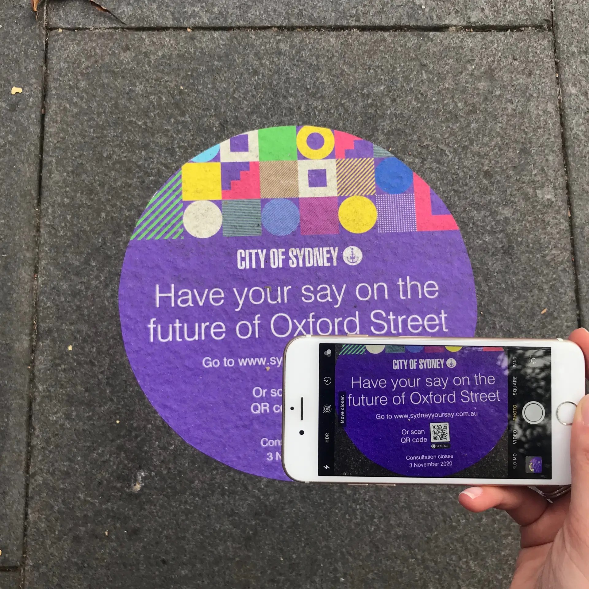 CRED Consulting, Phone taking photo of Have your say footpath decal