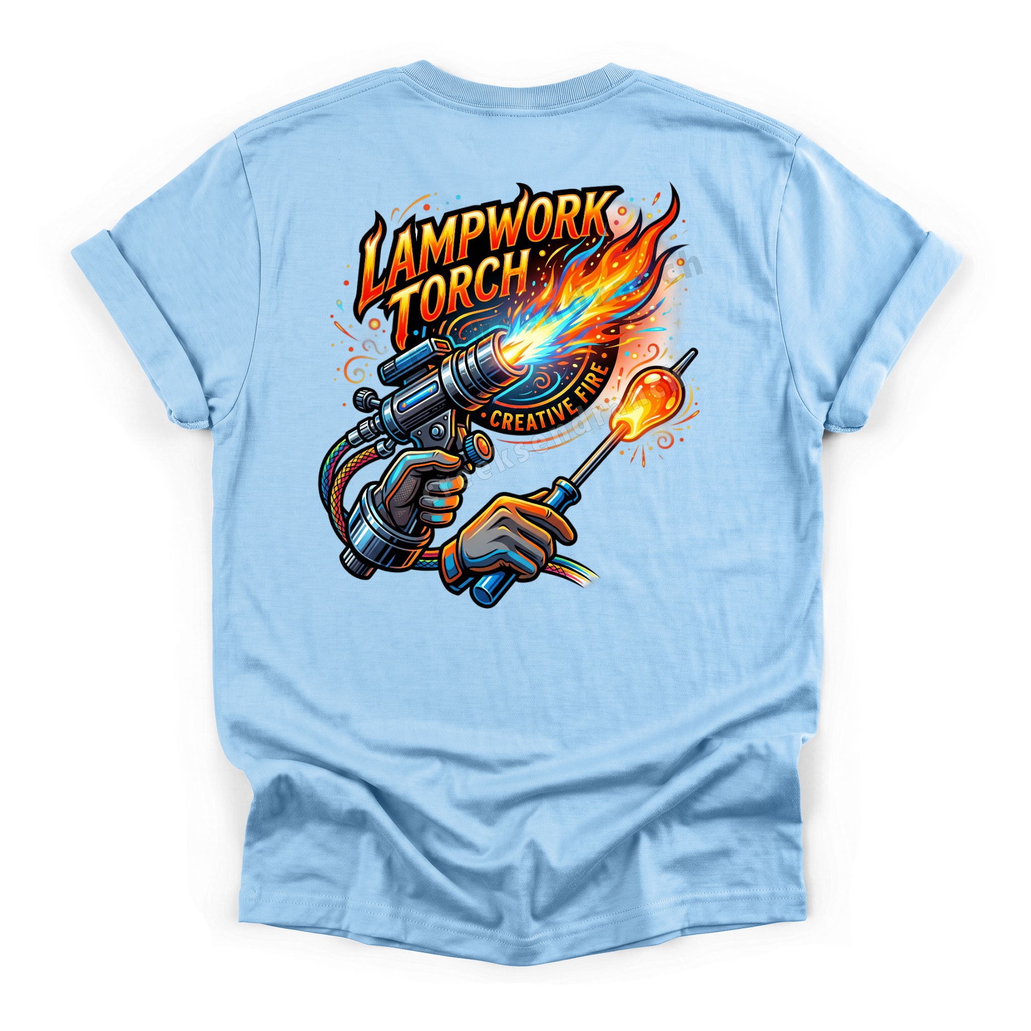 Back of a light-blue T-shirt with a vivid graphic of a lampworking torch and fiery flames, reading 'Lampwork Torch'.