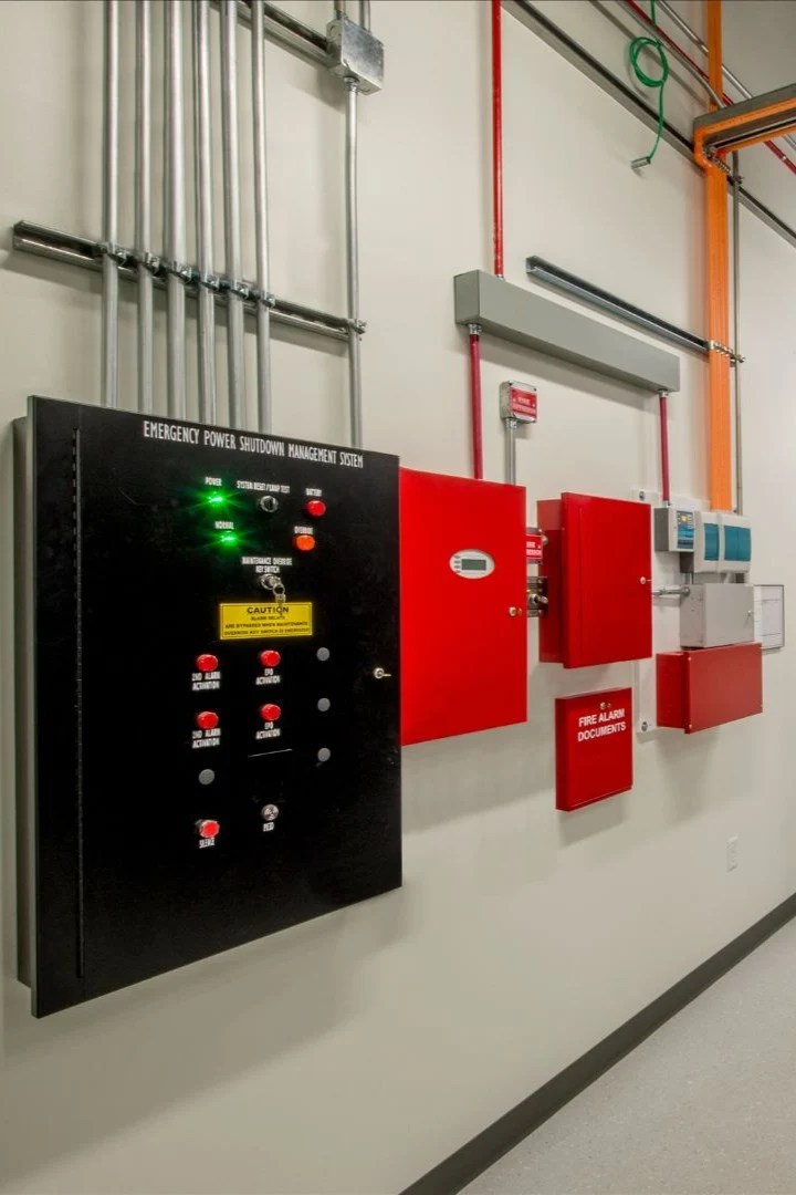 Fire suppression control panels and piping in an industrial facility corridor in Douglas WY