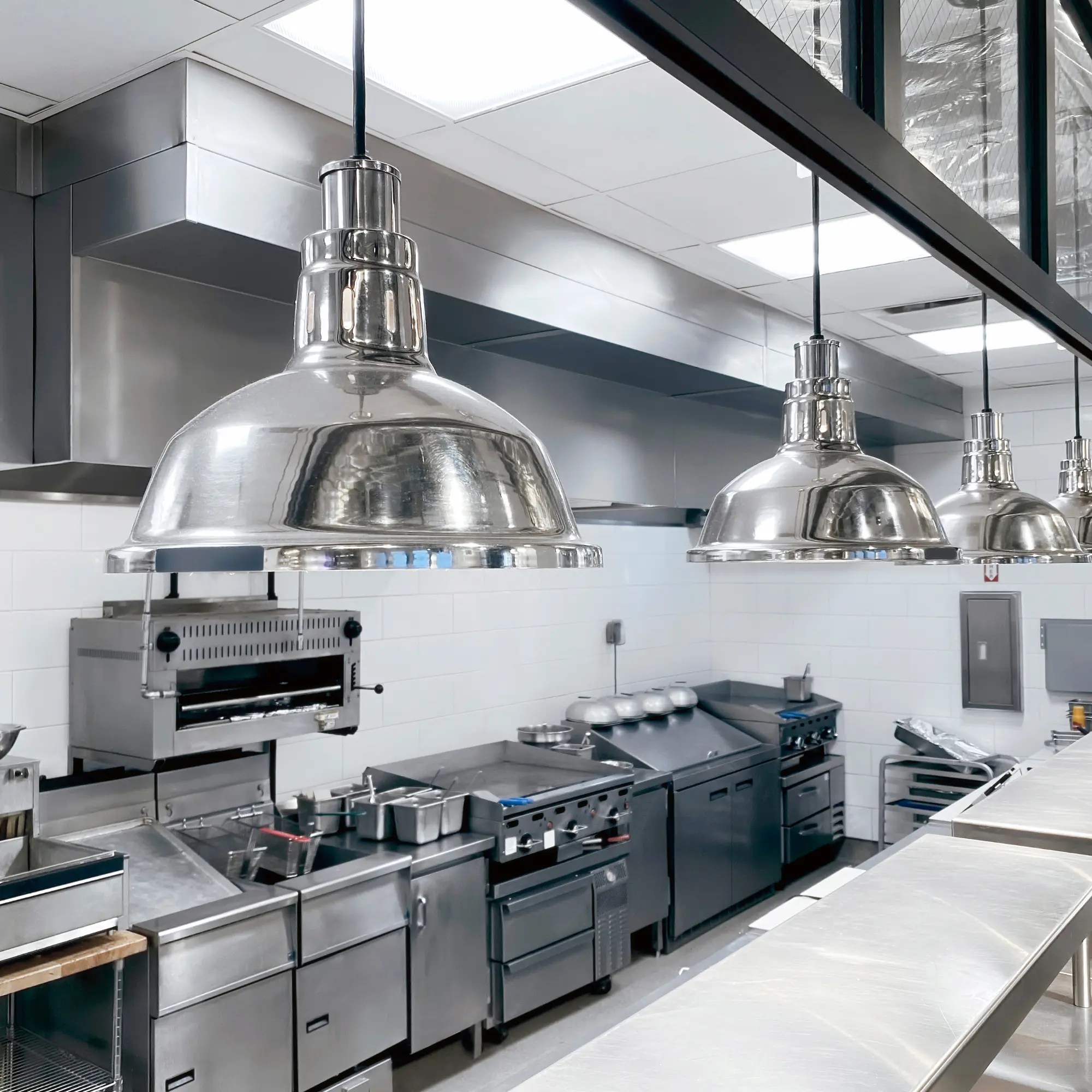 Stainless commercial kitchen with exhaust hoods ready for Ansul fire suppression service in Rock Springs, WY