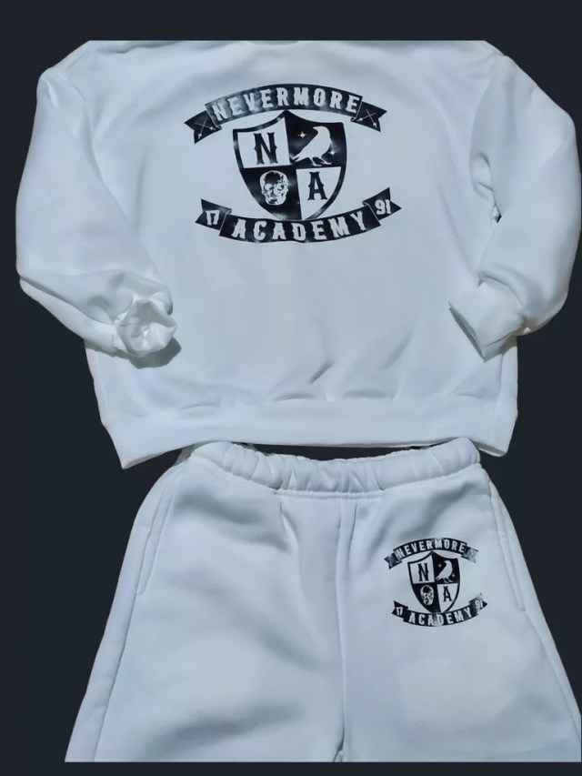 A stylish white tracksuit featuring the iconic Nevermore Academy logo, perfect for fans of the series.