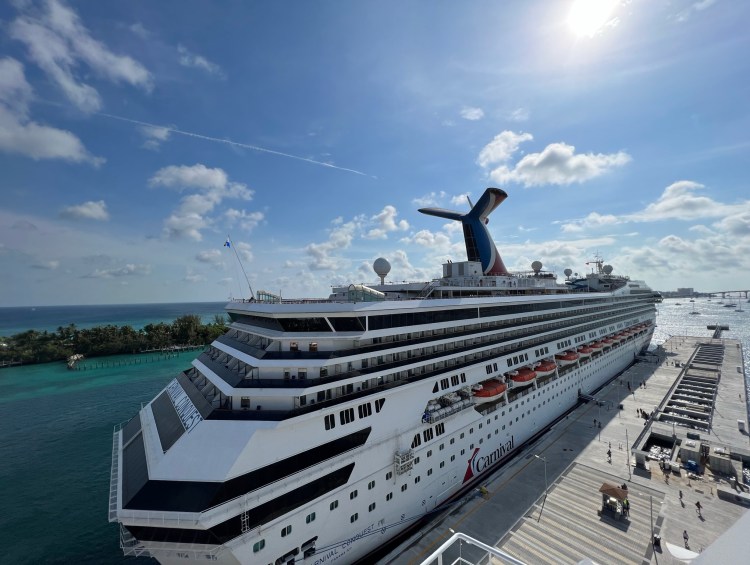 Cruise Ships - Cruise Ship Carnival Conquest Leaves the Port of Nassau Bahamas and Heads Out to Sea