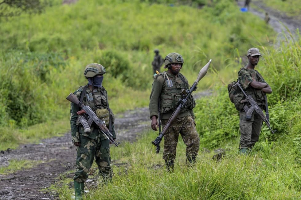 M23 rebels stand with their weapons in Kibumba, in the eastern of Democratic Republic of Congo, Dec. 23, 2022. (Credit: Moses Sawasawa/AP.)