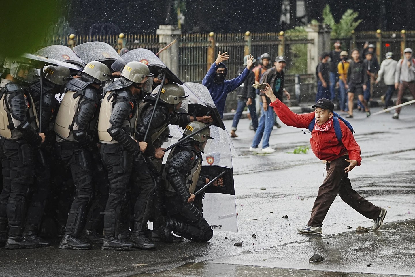 A demonstrator throws a rock against police in Jakarta, Indonesia, Aug. 28, 2025. (AP Achmad Ibrahim/AP.)