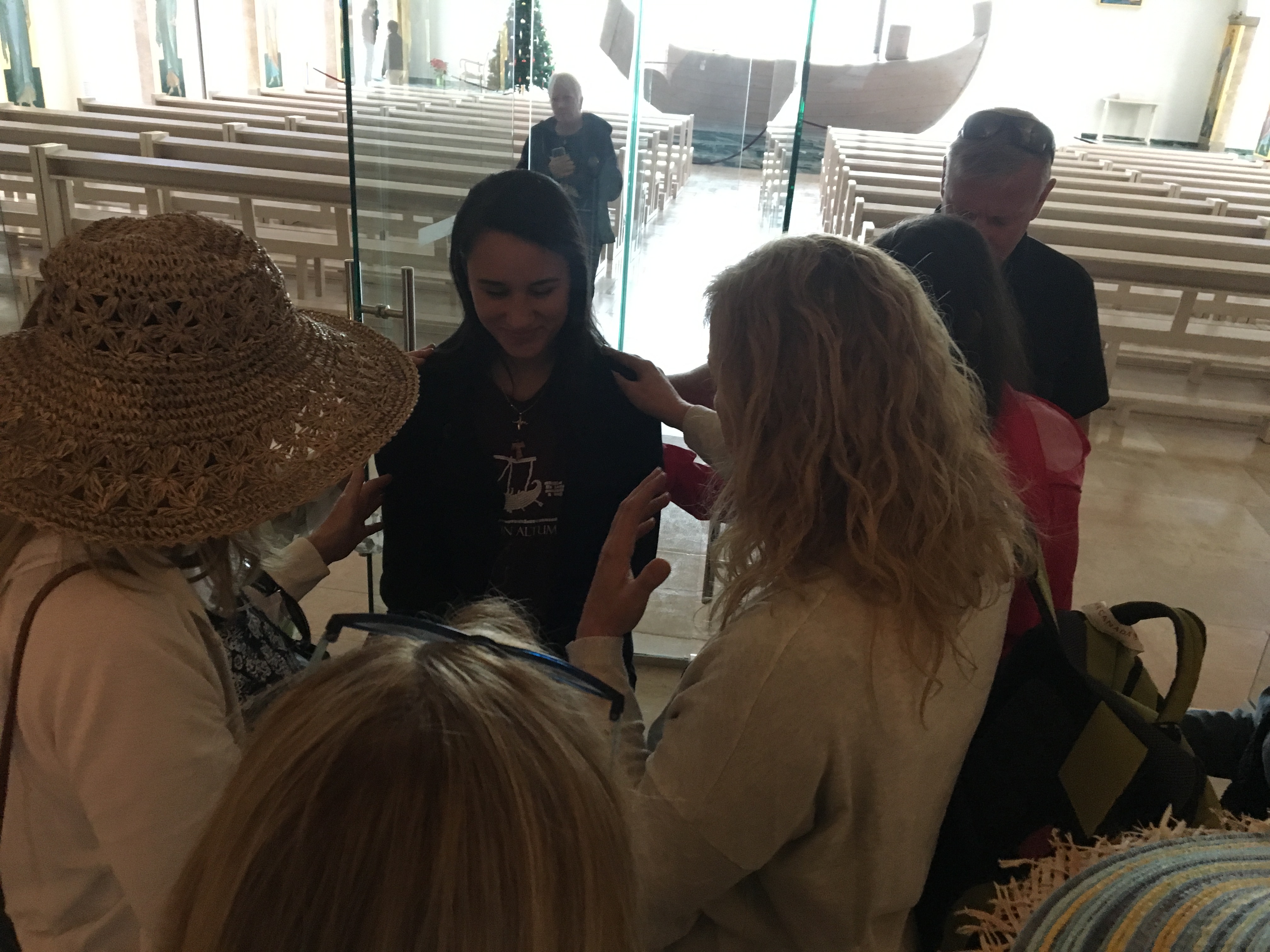 Praying with our guide at Magdala