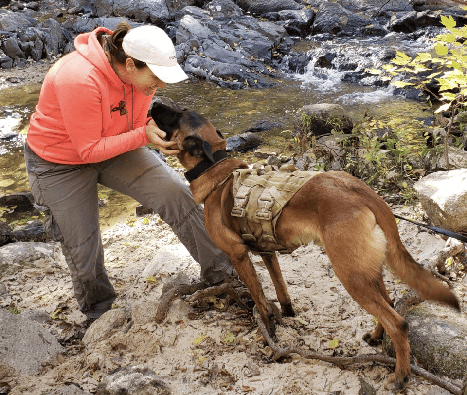 woman playing with a dog