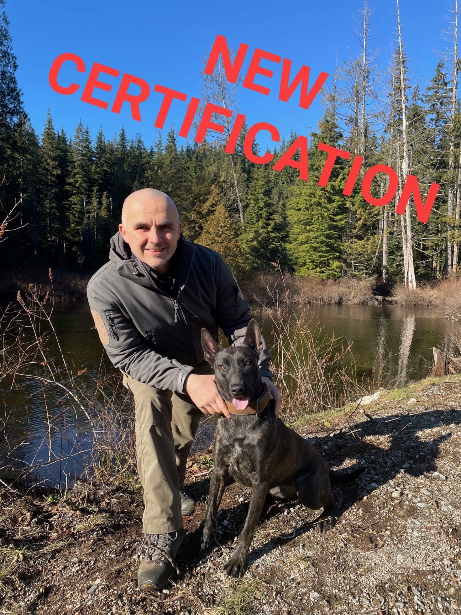Man kneeling next to a dog