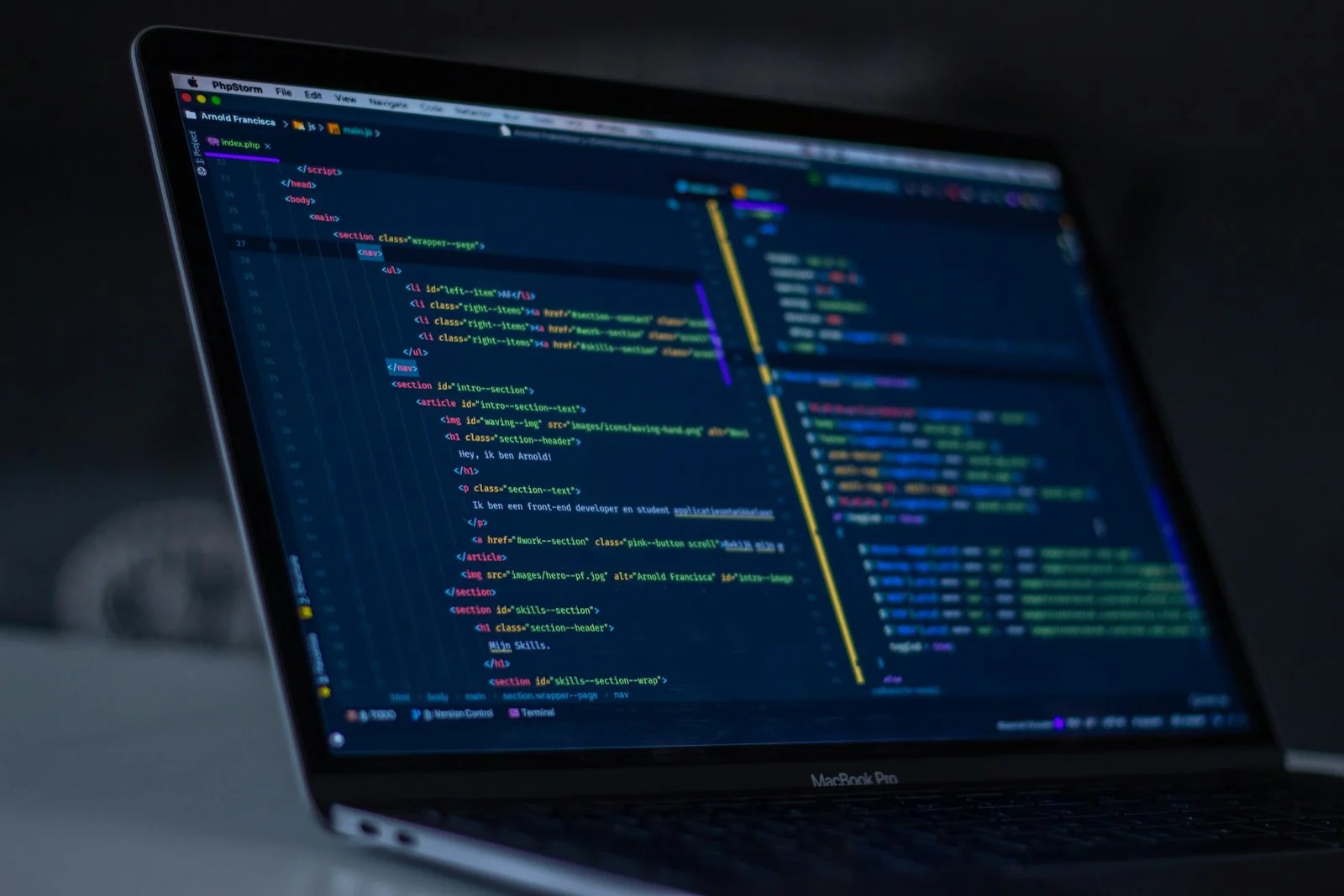 Laptop screen showing a code icon, representing custom website development