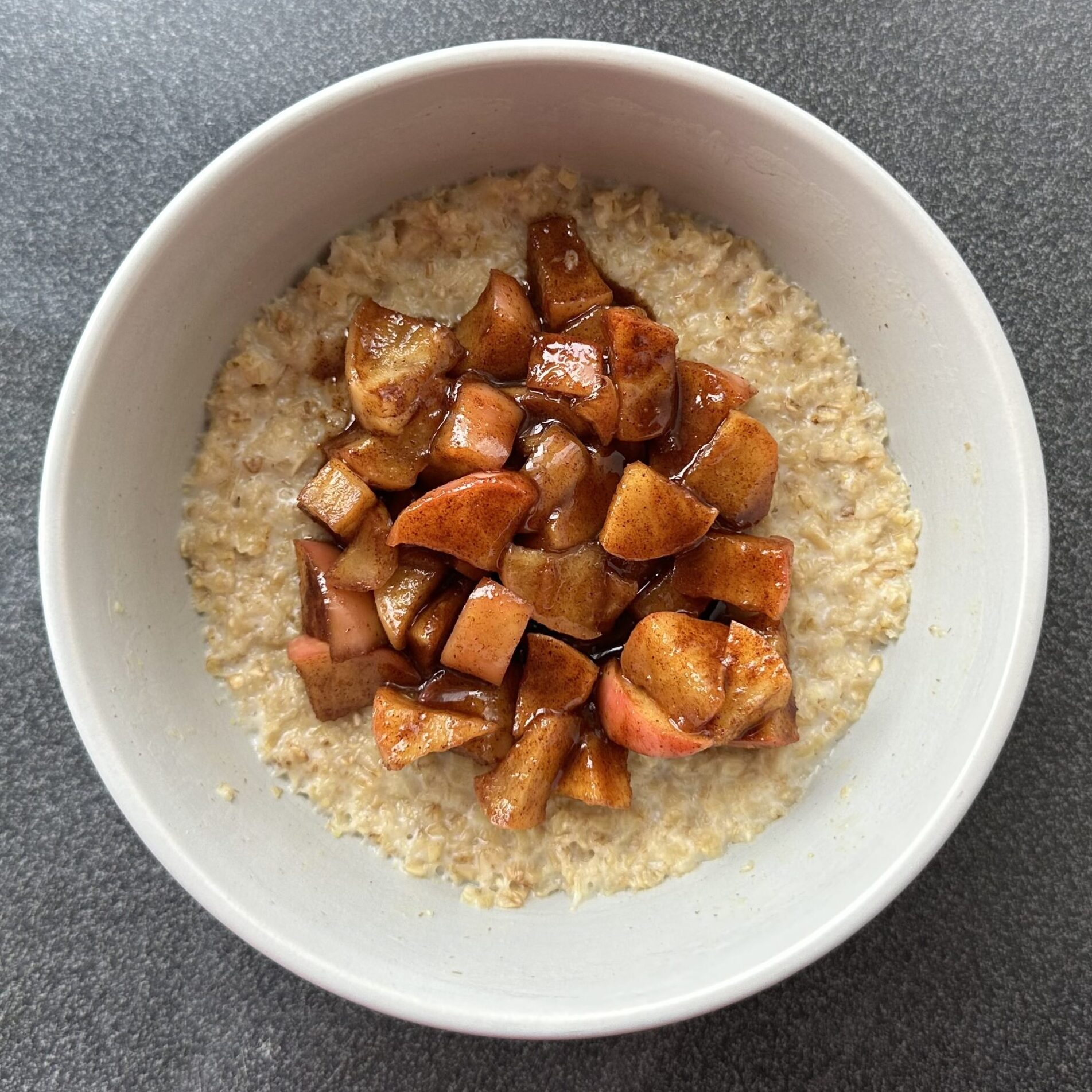 Creamy oats topped with cinnamon, apple and brown sugar mixture
