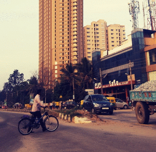 IOCOSE, 2015, Elevated Bangalore A collection of animated gifs where buildings of Bangalore, India, are elevated as advertised by the real estate agencies of the area. In Bangalore, people are constantly reminded that they should elevate themselves buying a flat in the E-city.