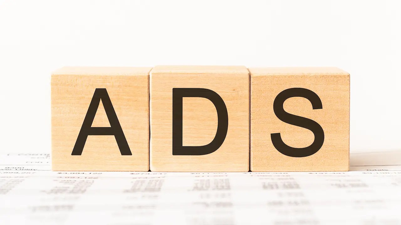 Wooden blocks spelling out the word "ads".