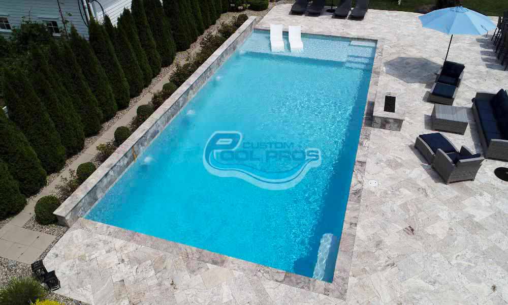 Elegant Concrete Pool Designs by Custom Pool Pros