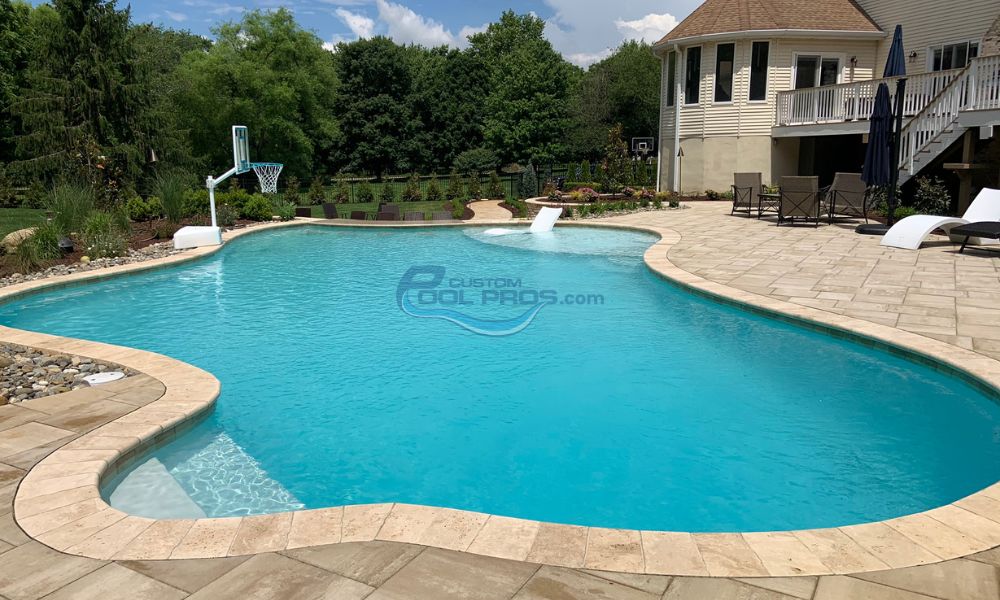 inground gunite pool with blue water bull nose coping