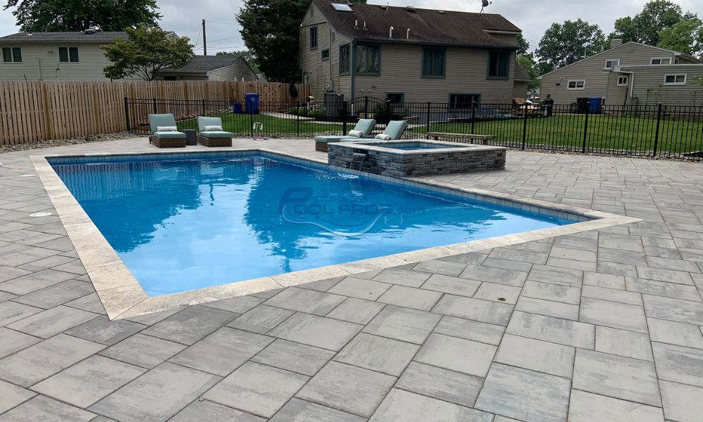 inground rectangular pool with spa