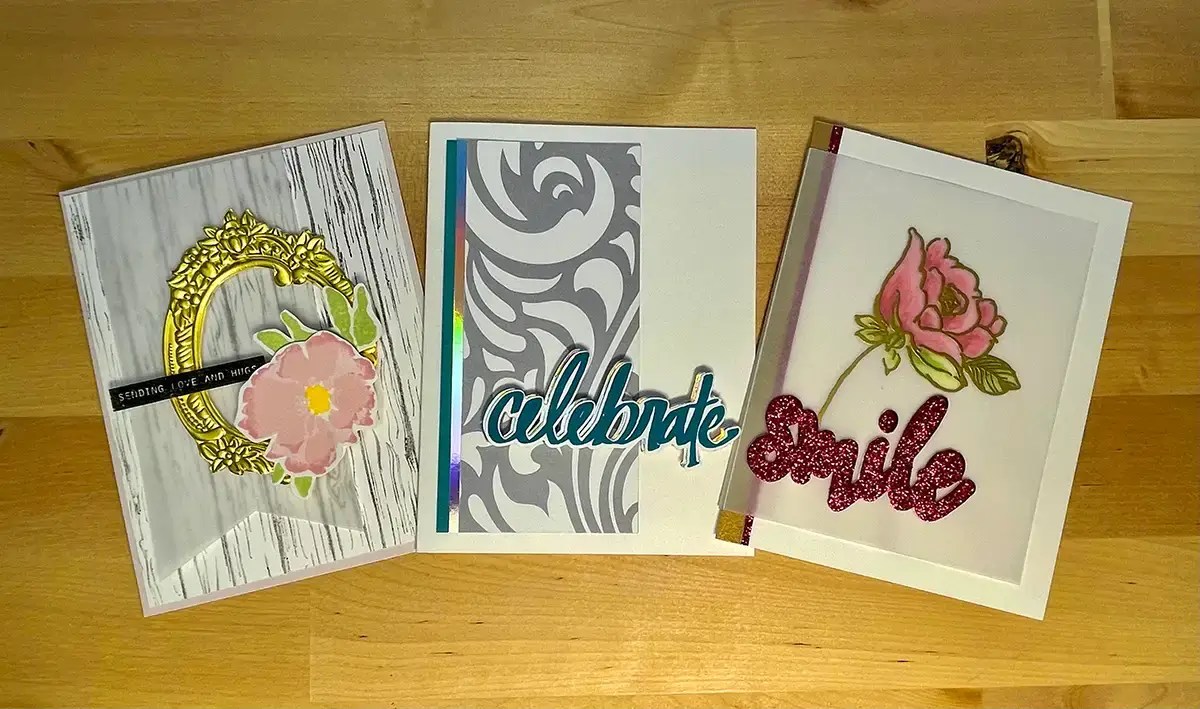 Three homemade greeting cards with personalized greetings on them.