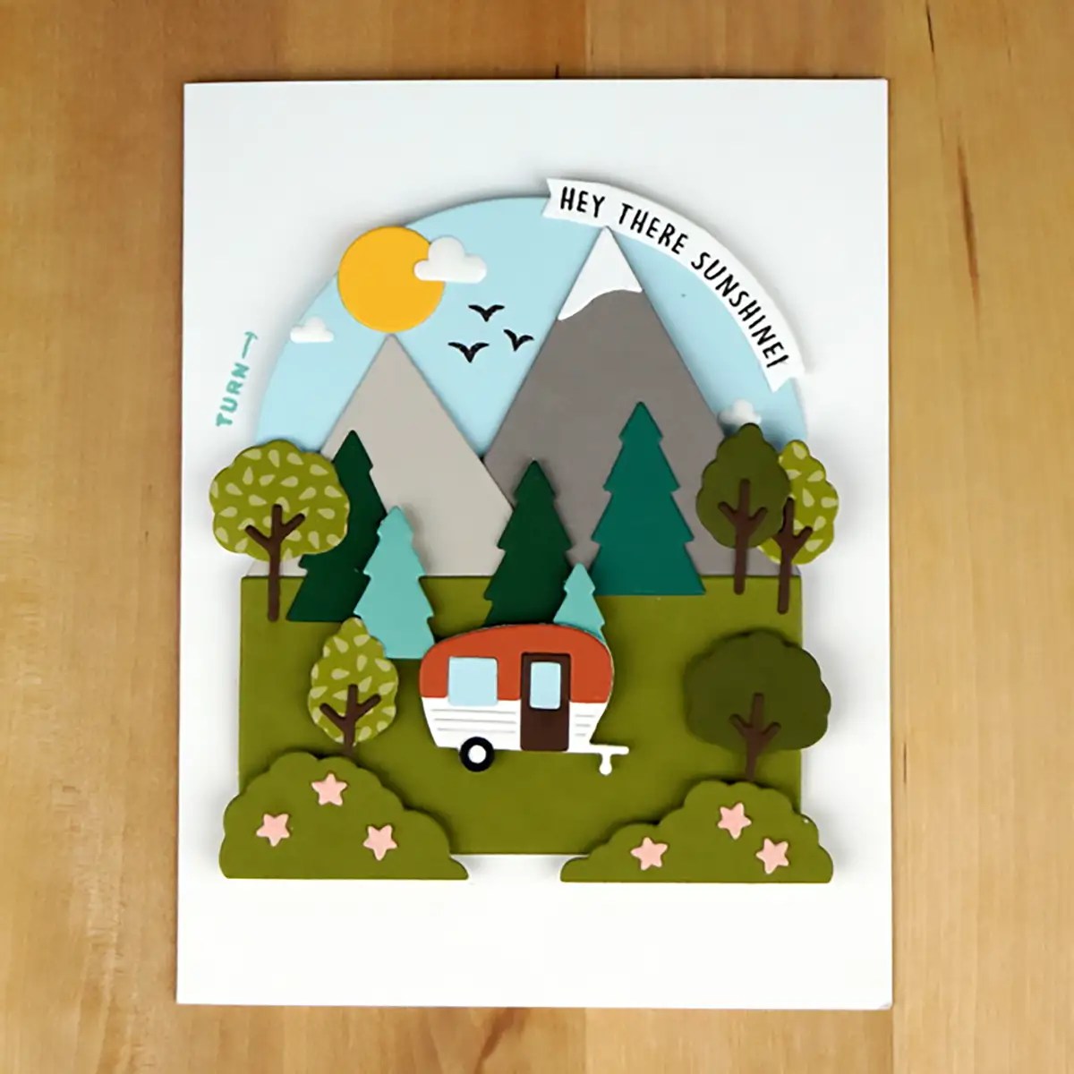 Cute camping card with a ring that changes the scene from day to night.