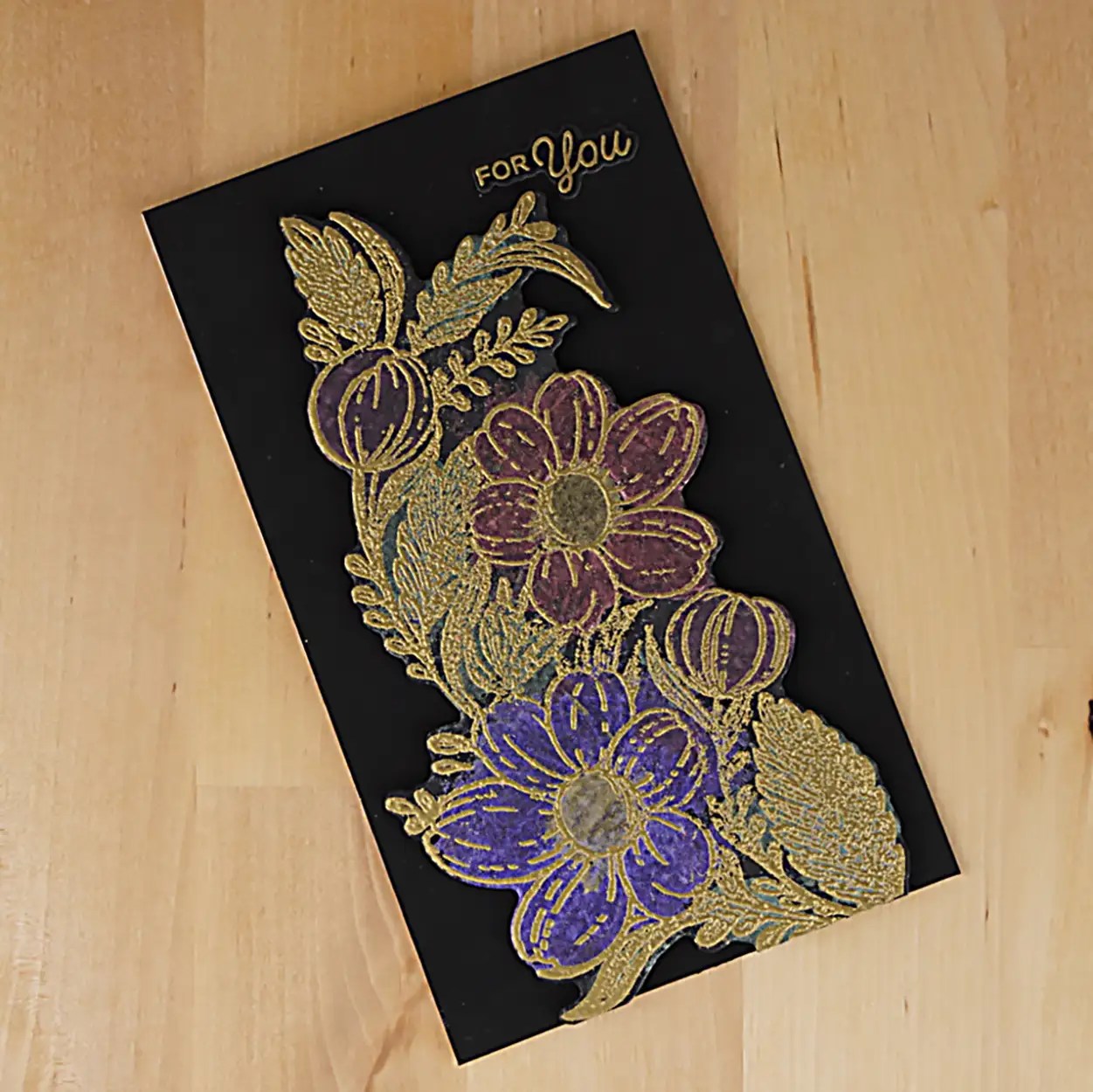 Pretty black hello card with gold embossing and painted with metallic paints.