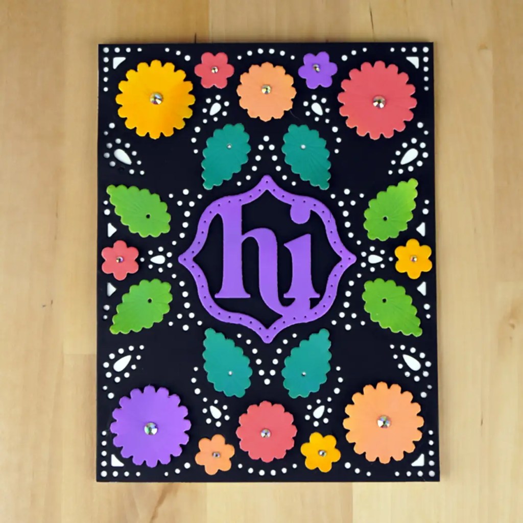 Bright and beautiful card created using the Spellbinders August Stitching Die of the Month.