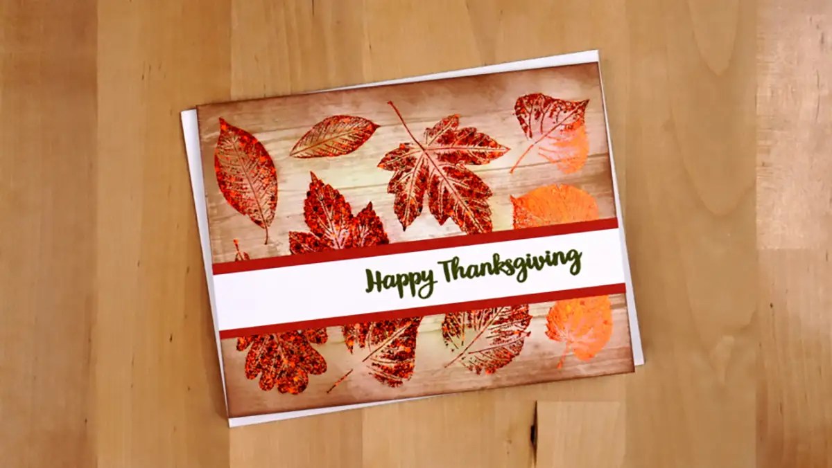 A happy thanksgiving card with leaves on it.