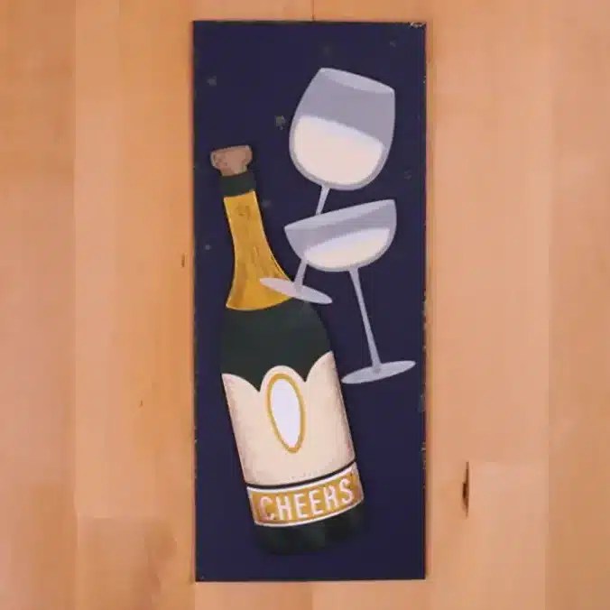 A greeting card with a bottle of wine and a glass of champagne. Cheers To Us