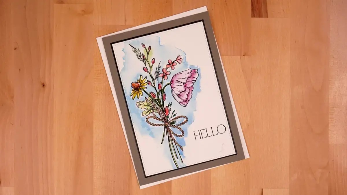 A greeting card with a butterfly and flowers on it.