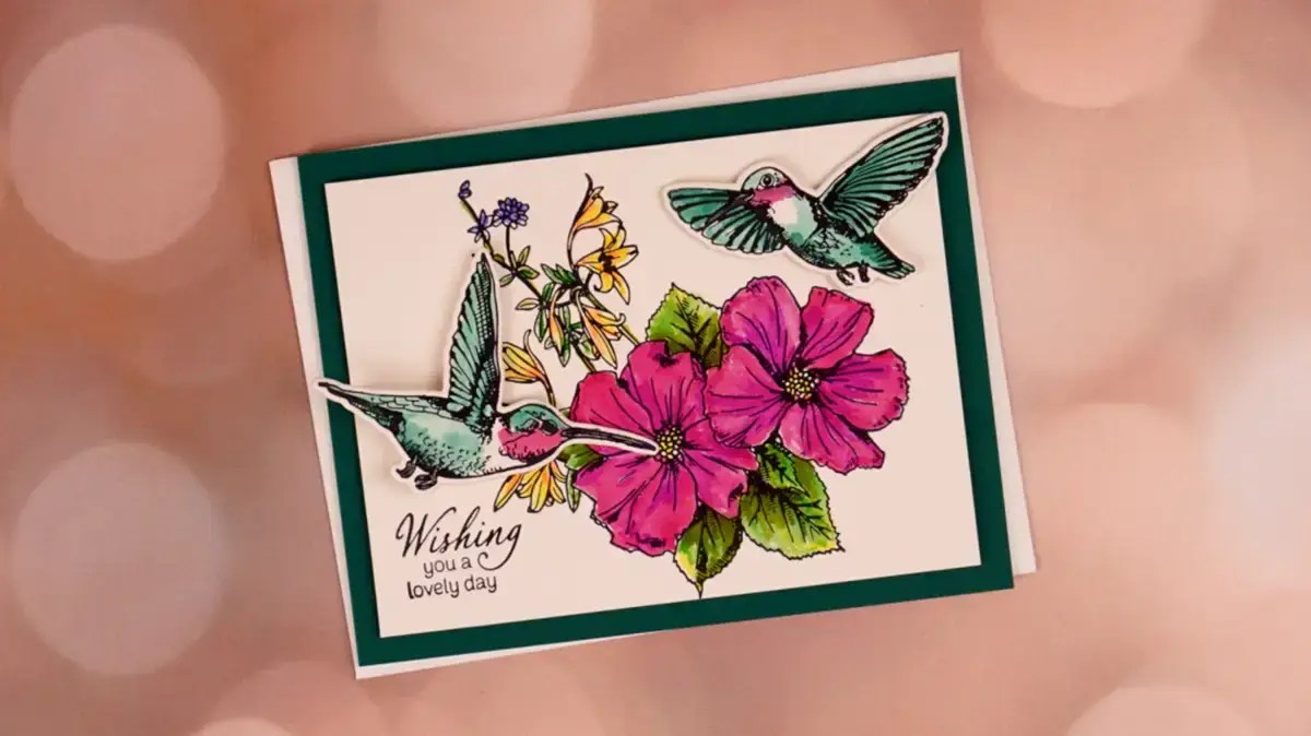 A card with hummingbirds and flowers on it.